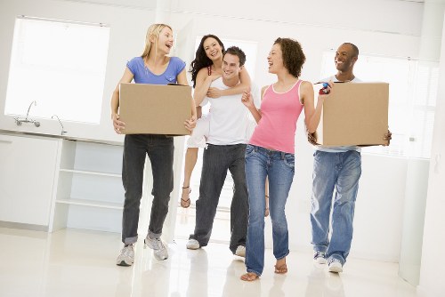Removal van and moving boxes for a home move in New Malden