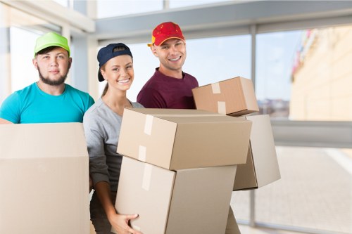 Man With A Van New Malden pricing discussion with moving boxes and van space