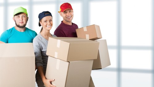 Packed boxes and furniture prepared for a local house move in New Malden
