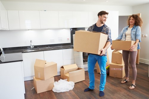 Boxes and furniture being unloaded at a New Malden property