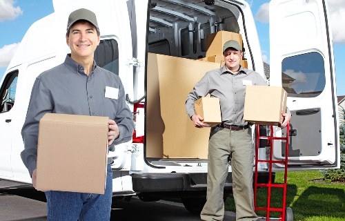 Professional movers handling office relocation near New Malden business streets