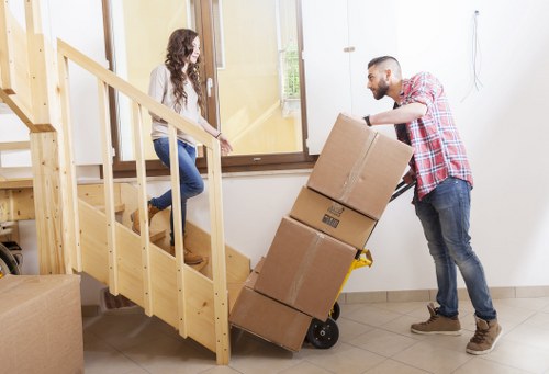 Packed boxes and furniture ready for transport in New Malden