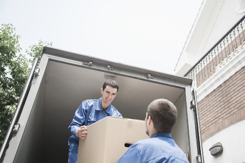 Careful handling of large furniture during a move in New Malden