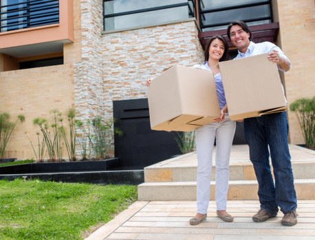 Local moving team handling boxes and household items in New Malden